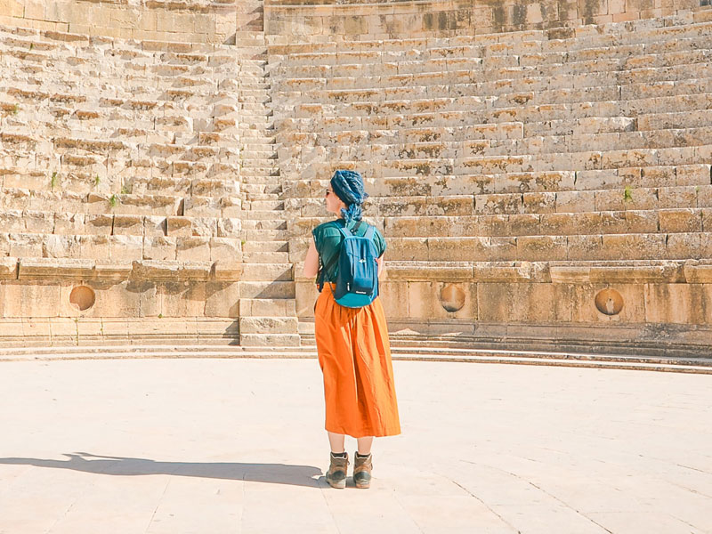 Traveler in Ancient Amphitheater Traveler in Ancient Amphitheater
